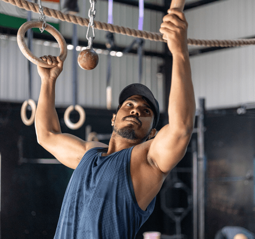 Athlete training on rings at CaliOG